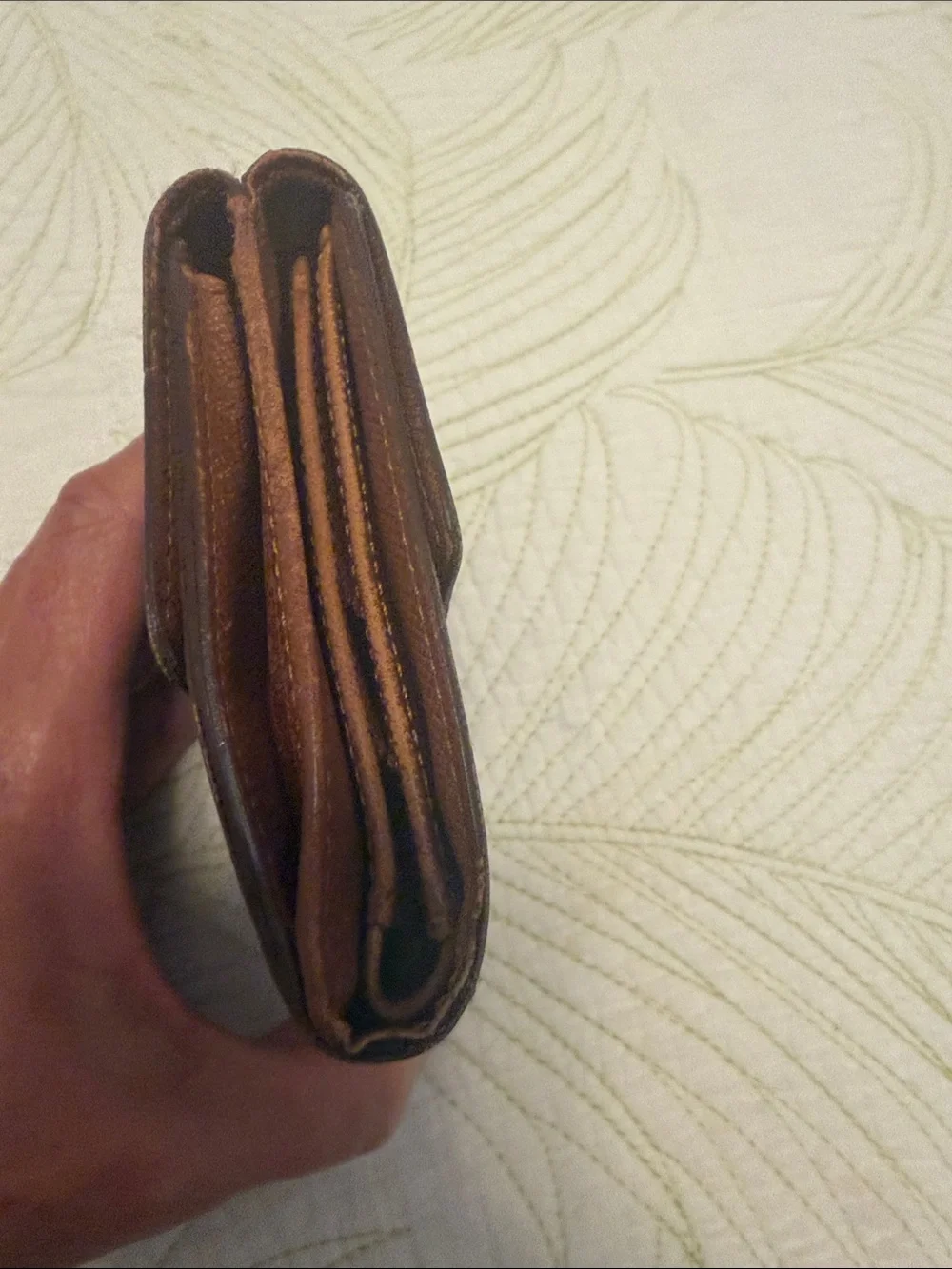 Louis Vuitton trifold snap wallet. Authentication provided.